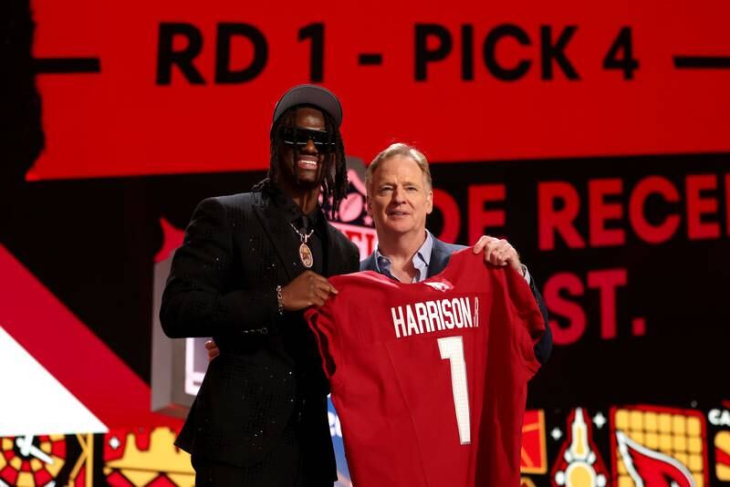 DETROIT, MICHIGAN - APRIL 25: (L-R) Marvin Harrison Jr. poses with NFL Commissioner Roger Goodell after being selected fourth overall by the Arizona Cardinals during the first round of the 2024 NFL Draft at Campus Martius Park and Hart Plaza on April 25, 2024 in Detroit, Michigan. (Photo by Gregory Shamus/Getty Images)