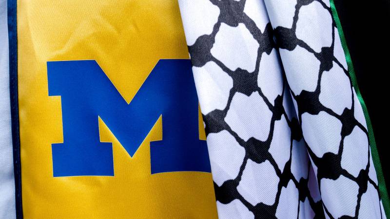 ANN ARBOR, MICHIGAN - MAY 4: A student wears a  keffiyeh in support of Palestine during the University of Michigan's Spring Commencement ceremony on May 4, 2024 at Michigan Stadium in Ann Arbor, Michigan. A group of students called for the University of Michigan to divest from companies with ties to Israel during the spring commencement ceremony.   (Photo by Nic Antaya/Getty Images)