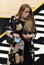 2021: Singer Adele walks in during the second half in Game Five of the NBA Finals between the Milwaukee Bucks and the Phoenix Suns at Footprint Center on July 17, 2021, in Phoenix.