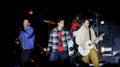 EAST RUTHERFORD, NEW JERSEY - FEBRUARY 17: The Jonas Brothers perform during a pre-game concert prior to the 2024 Navy Federal Credit Union Stadium Series at MetLife Stadium on February 17, 2024 in East Rutherford, New Jersey. (Photo by Bruce Bennett/Getty Images)